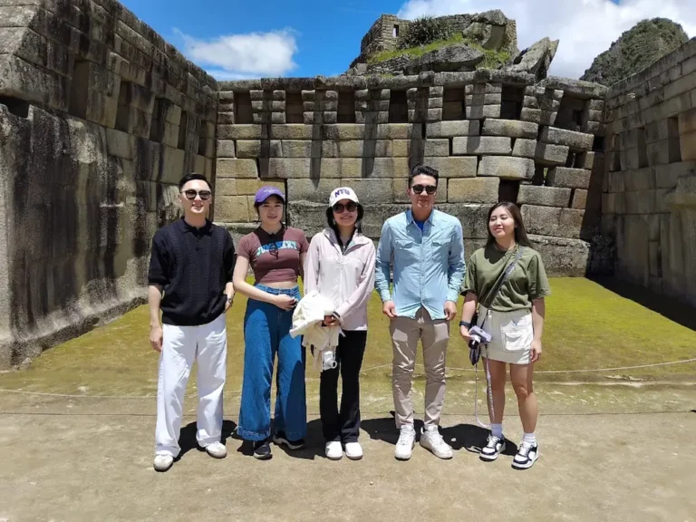 tourists at the ruins of Machu Picchu